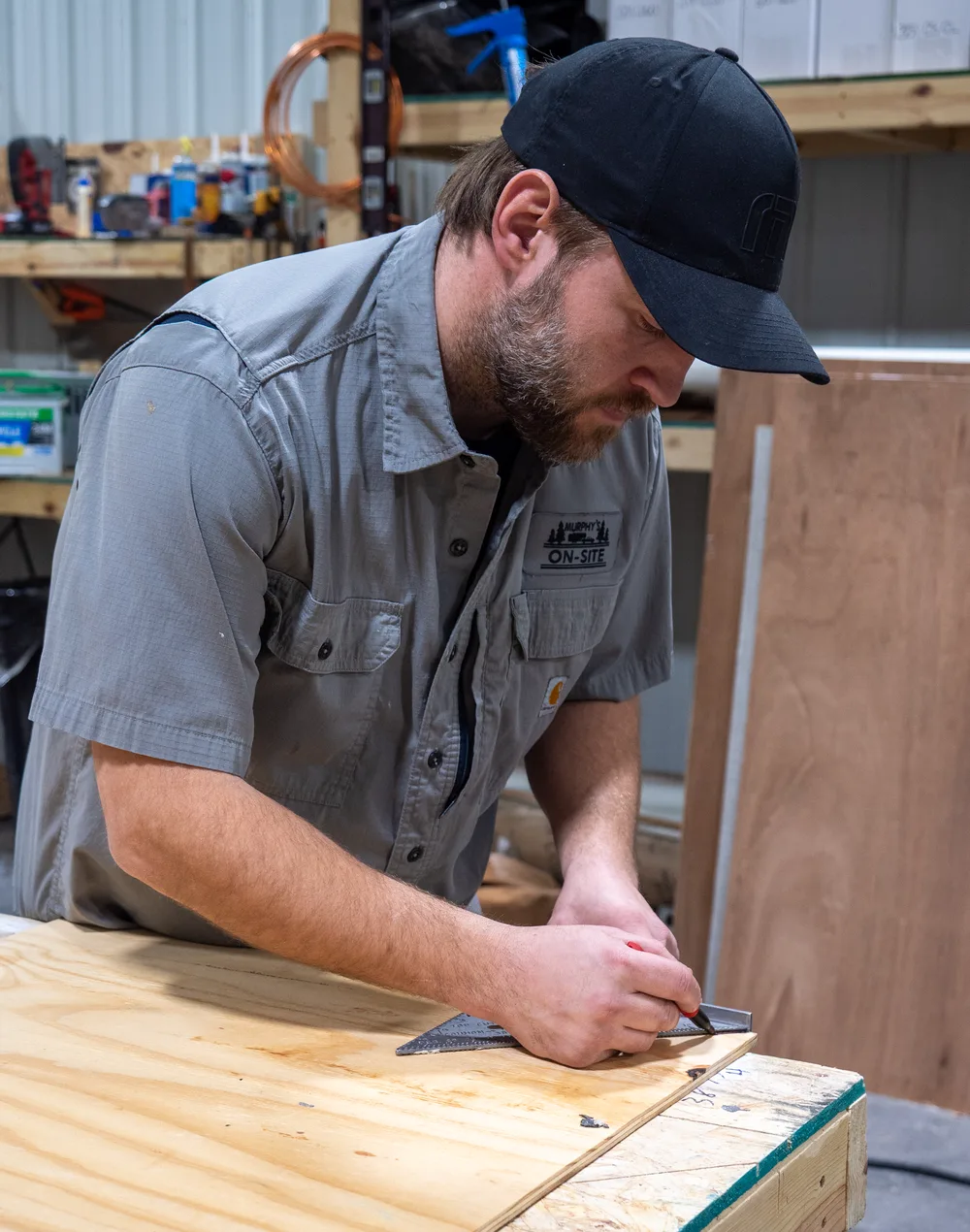 Murphy technician measuring material at a workbench