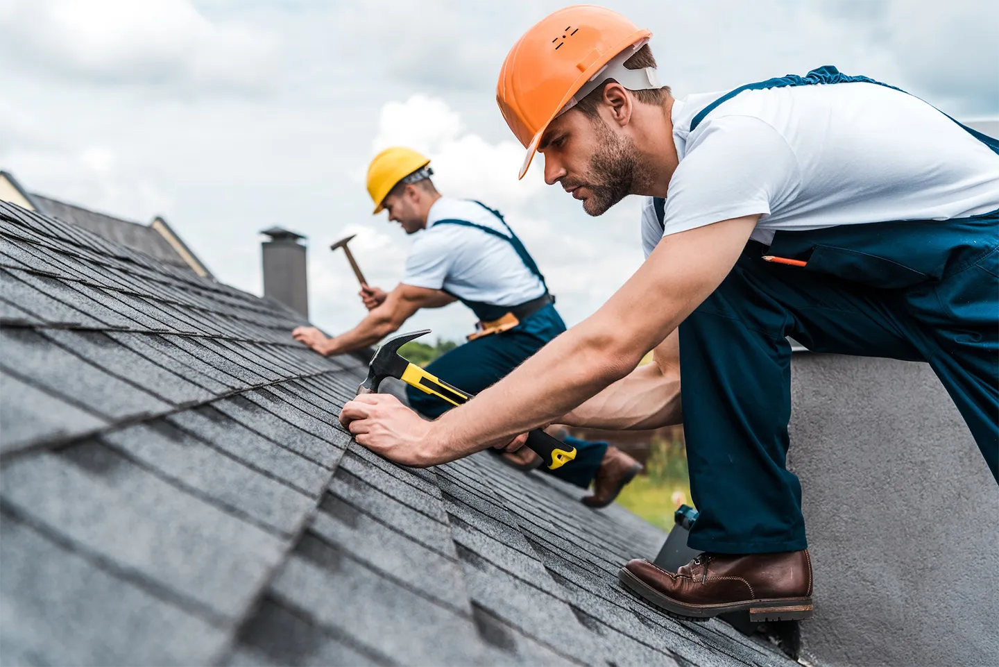 RV repair crew working on a roof